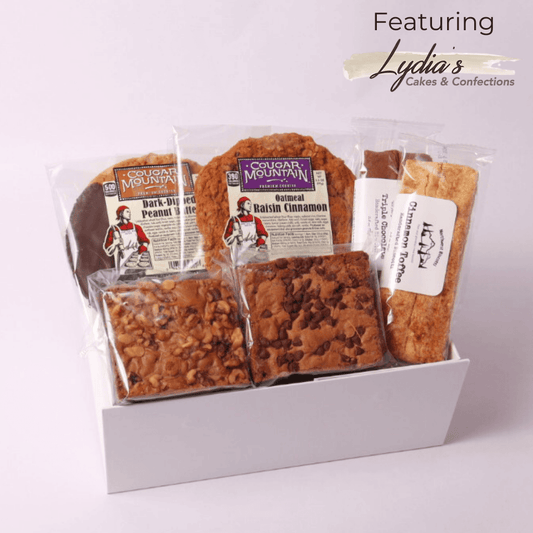 A delicious Pacific northwest Bakery gift Box featuring Northwest Biscotti, Cougar Mountain cookies, and Lydia’s Cakes & Confections brownies—perfect for a thank you gift, foodie gift, or corporate client treat.