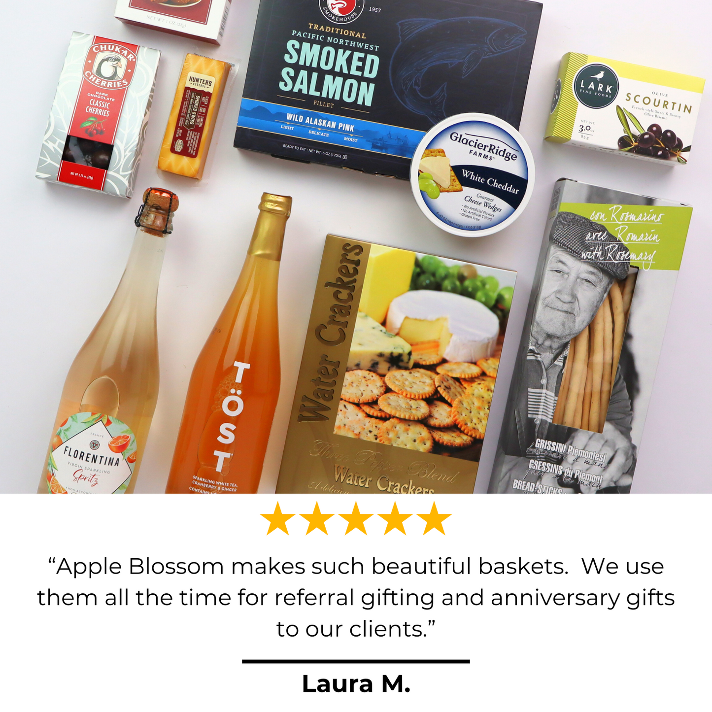 Non-Alcoholic Wine Basket with 5 star review that says “Apple Blossom makes such beautiful baskets. We use them all the time for referral gifting and anniversary gifts to our clients