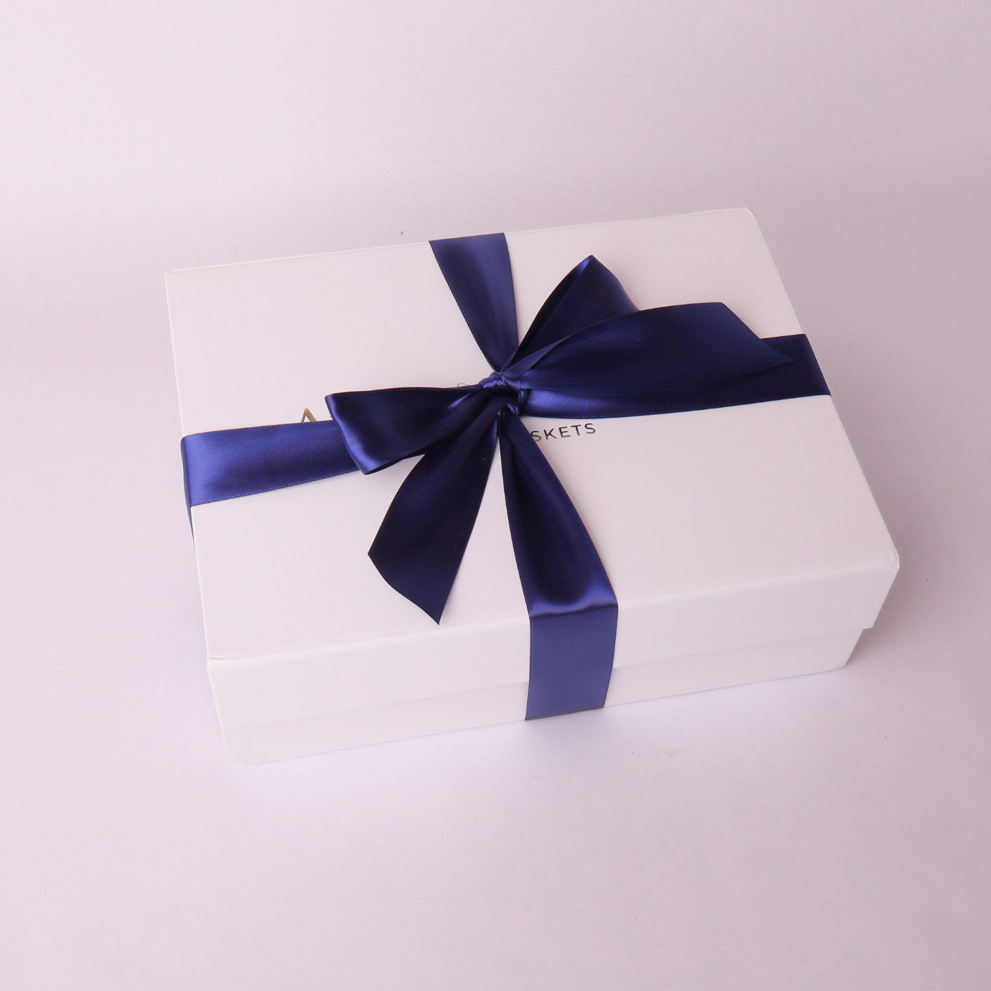 Summer BBQ gift basket with white box and navy ribbon, perfect for Father's Day or corporate gifting.