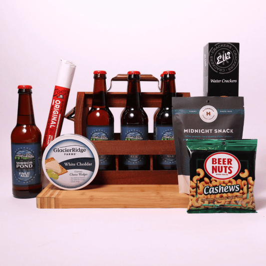 PNW Beer and Snack Crate filled with Mirror Pond Pale Ale, Beer Nuts, gourmet snack mix, cheese wedges, salami stick, and crackers in a wooden crate with a bottle opener.