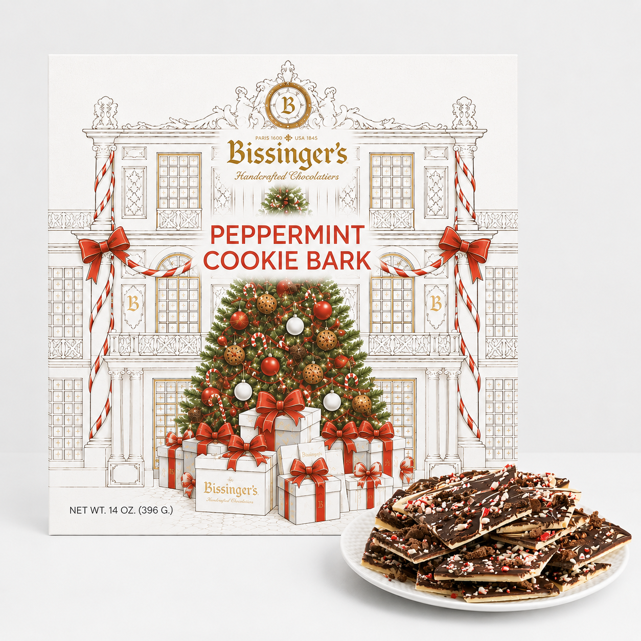 Bissinger's Handcrafted Chocolates Peppermint Cookie Bark box shown next to a plate of chocolate bark pieces on a white background.