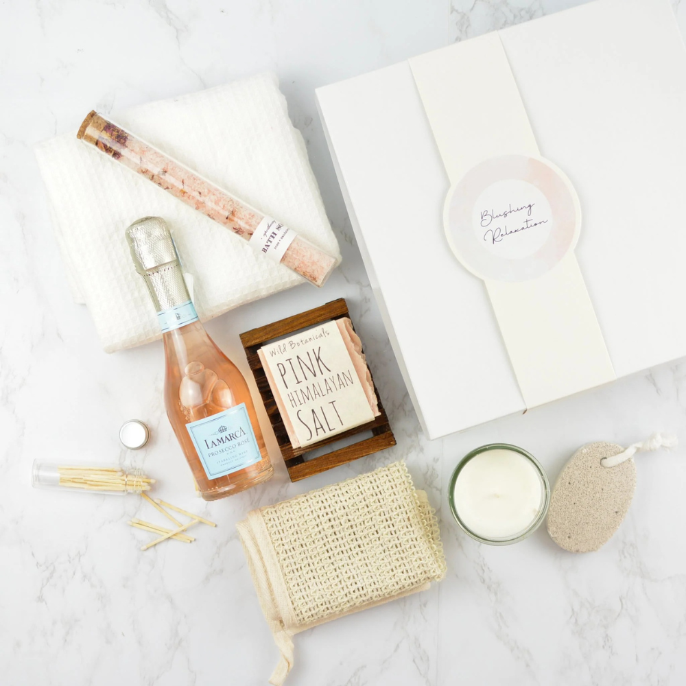Blushing Relaxation Gift Box with rosé, candle, bath salts, towel, and spa essentials