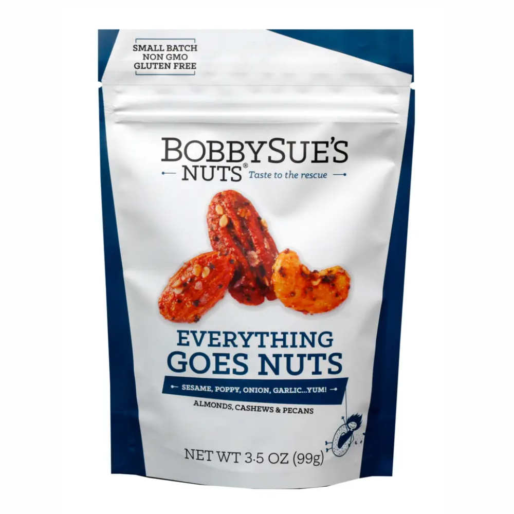A 3.5 oz stand-up pouch of Bobby Sue's Nuts Everything Goes Nuts, featuring a white and navy blue design with an image of roasted nuts on the front.