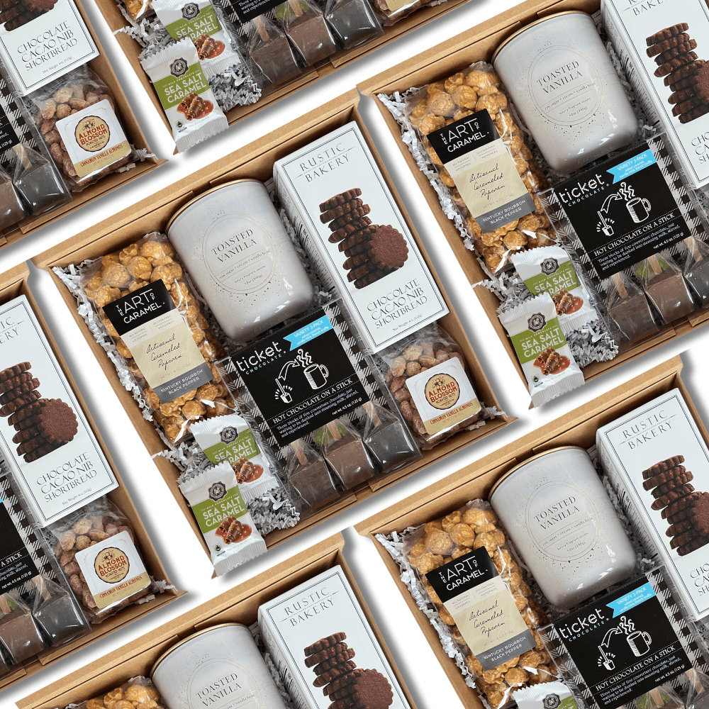 cocoa and sweet treat holiday corporate gift box included a toasted marshmallow candle, cocoa stir sticks, cookies, popcorn and chocolates