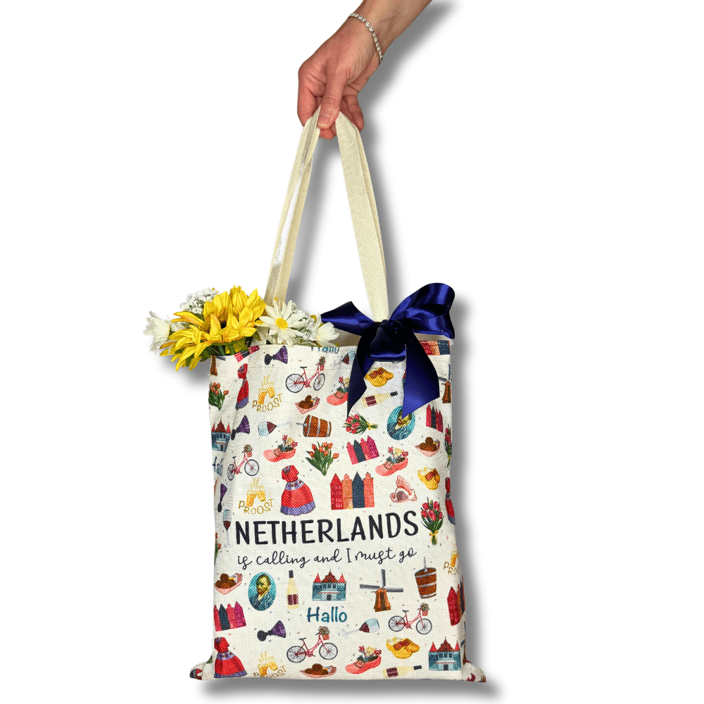 corporate travel send off gift bag for a Netherlands trip.  Included windmill cookies and travel snacks