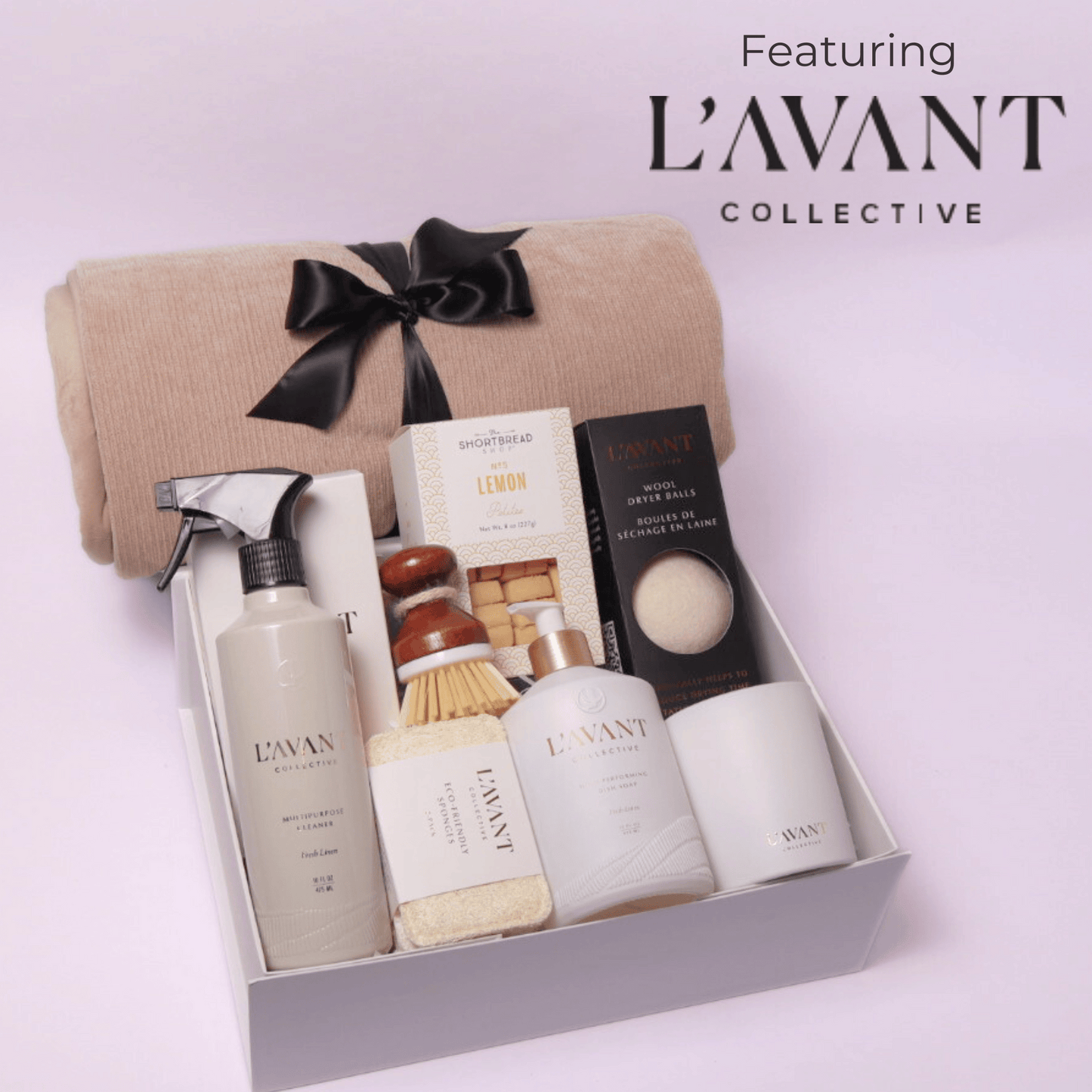 Luxury gift box featuring Seattle based Lavant collective luxury home products. This luxury high end gift box includes: multipurpose cleaner, scrub brush, dish soap, candle, dryer balls, cookies and a luxe cream cozy throw.