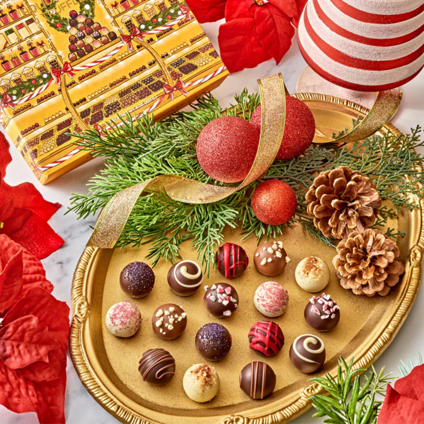 Inside view of Bissinger’s Holiday Cheer Truffles box showing rows of handcrafted chocolates with festive wrapping.