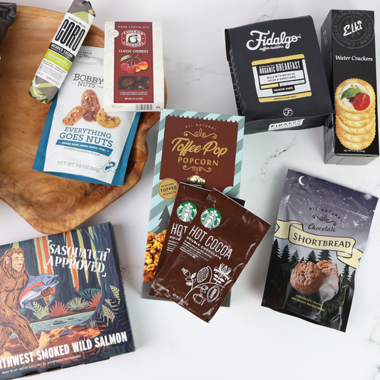 Assorted washington made products including snacks and coffee on a white surface