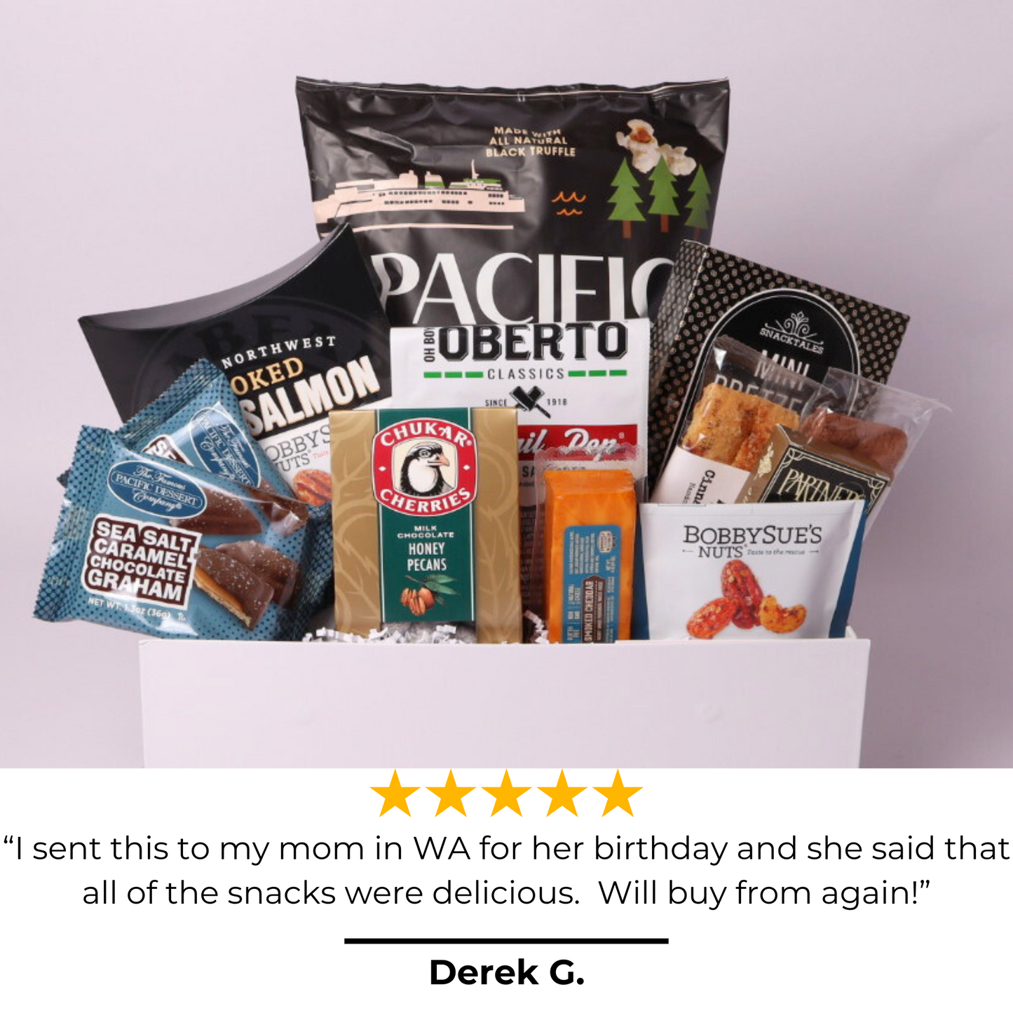 Top-rated snack gift box featuring artisan popcorn, nuts, chocolates, and more, tied with a navy blue satin bow. A five-star customer favorite for corporate gifting, birthdays, and special occasions.