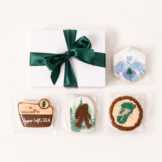 Pacific Northwest Cookie Gift Box with individually wrapped Seattle-inspired cookies and white gift box with green ribbon