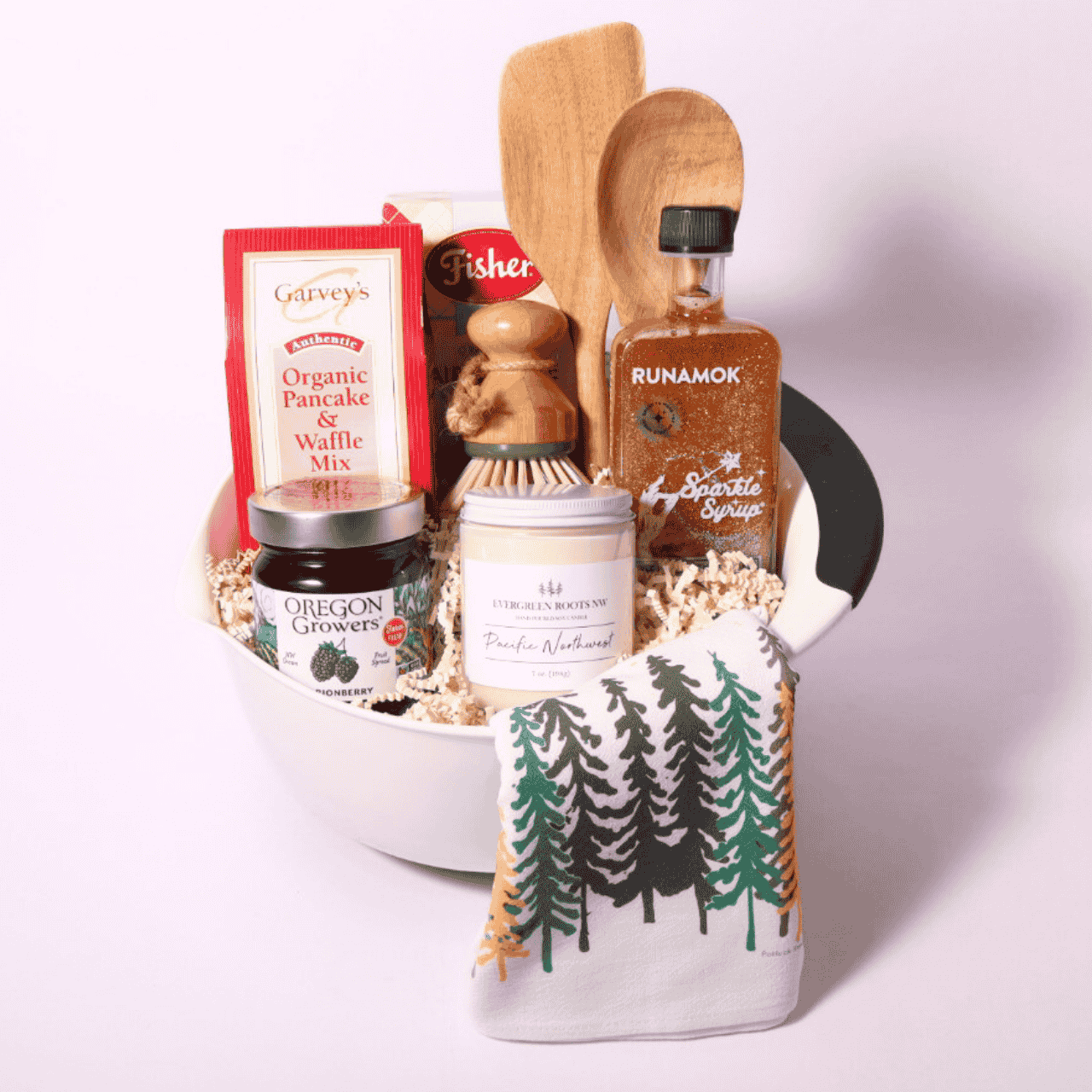 Gourmet baking breakfast gift basket featuring Pacific Northwest scone mix, sparkling maple syrup, Marionberry jam, and pancake mix with dish towels and kitchen utensils—a perfect gift for breakfast lovers
