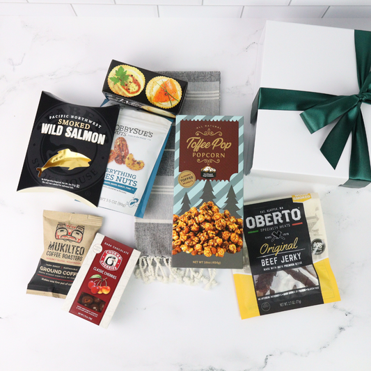 Gourmet snacks included in the Washington snack box, including smoked salmon, chocolate truffles, crackers, and savory treats