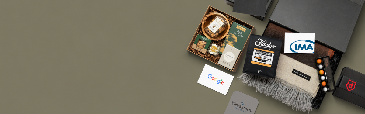 Collection of branded items including a box, cards, and a bag on a gray background