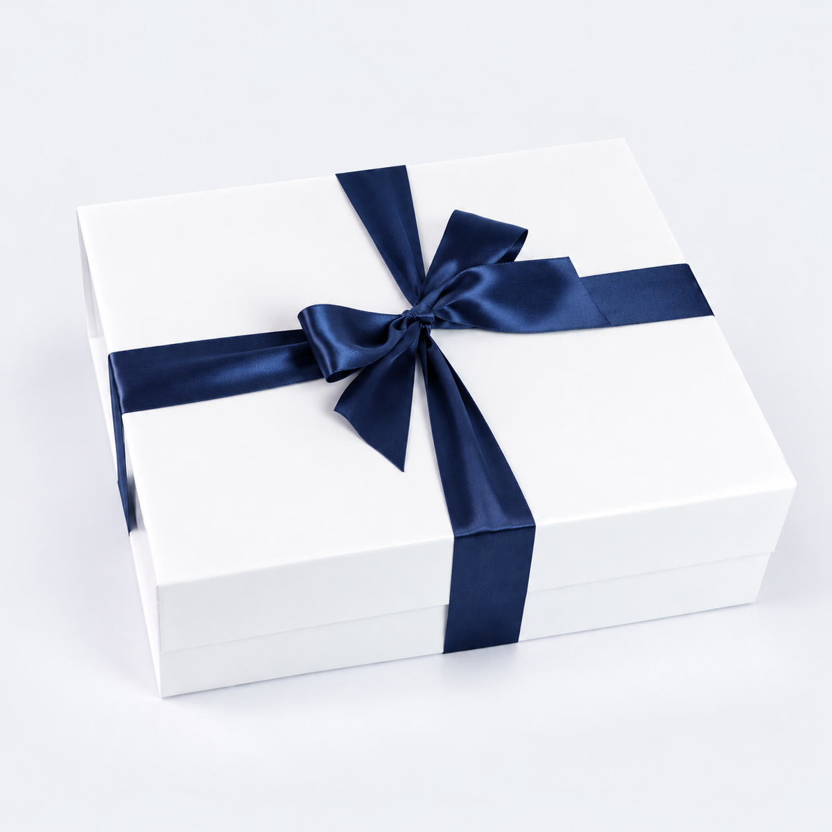 white soft touch gift box with navy blue satin bow