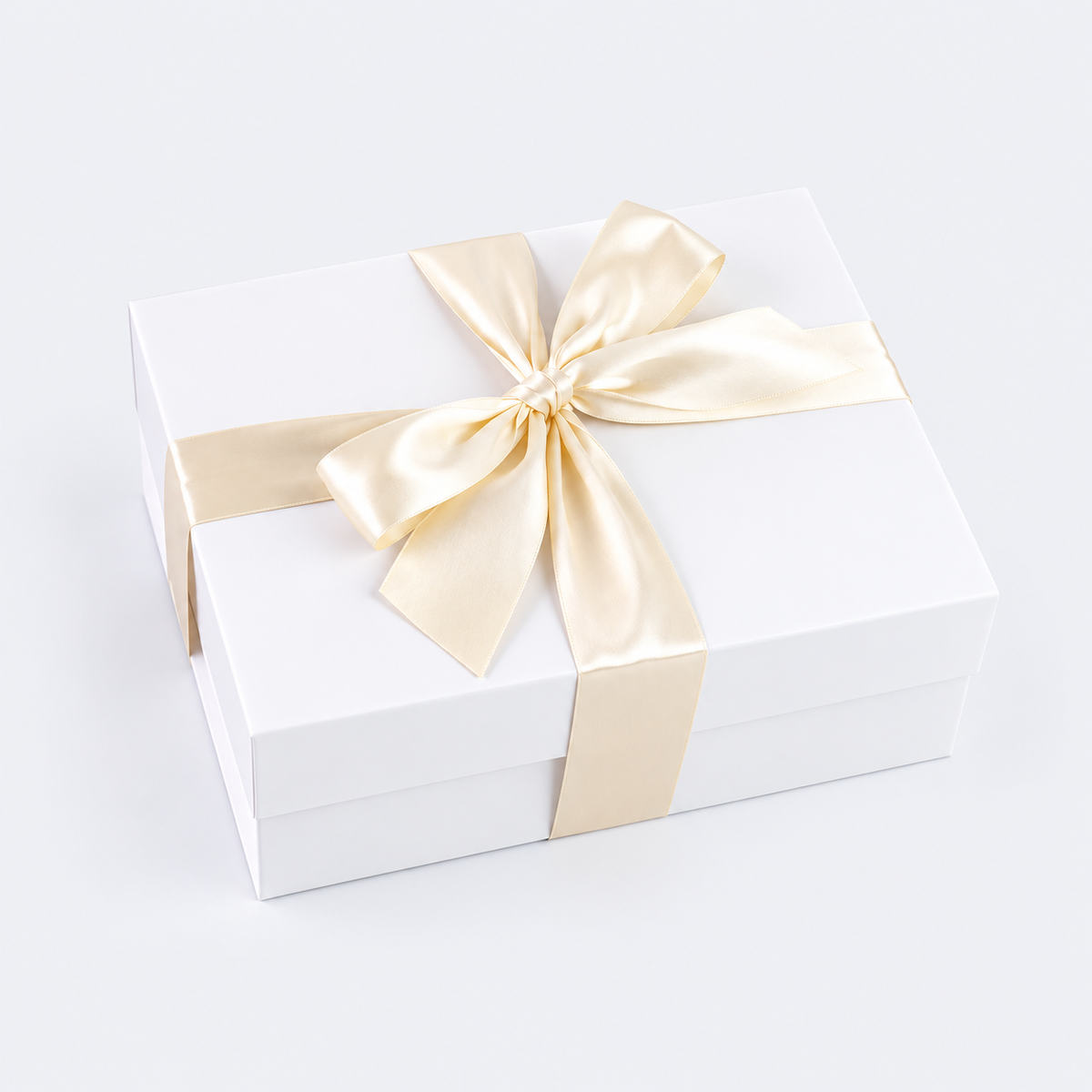 white gift box with satin ivory bow