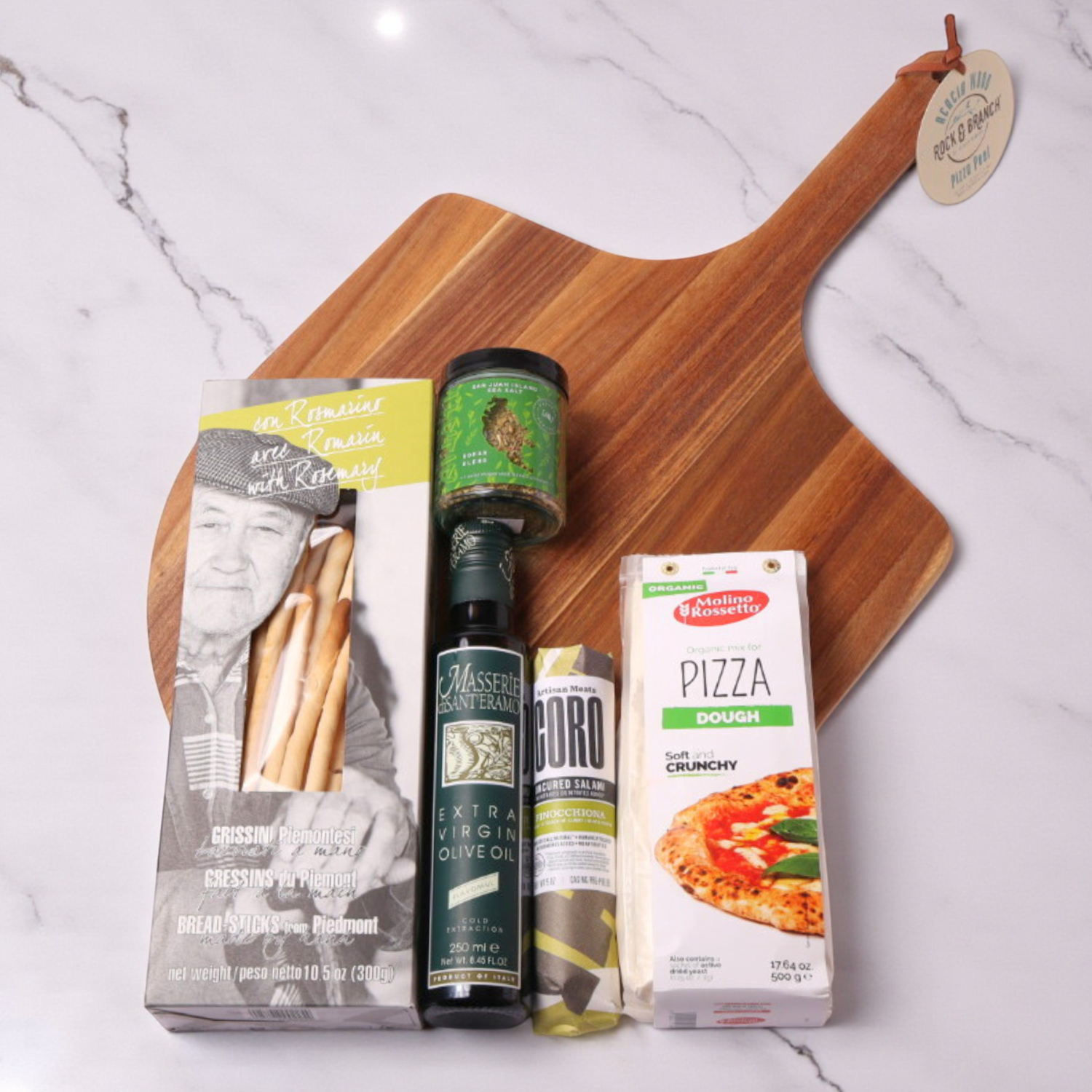 pizza night family gift set with pizza peel, olive oil, crackers, pizza dough, seasoning and salami