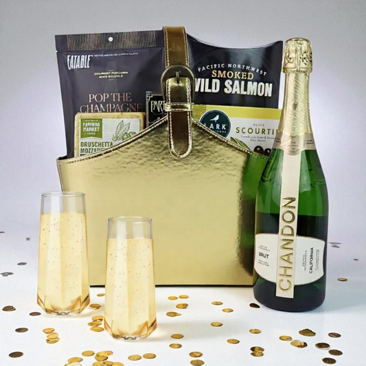 Luxury gold gift basket with Chandon Brut sparkling wine, Pacific Northwest smoked salmon, popcorn, and gourmet snacks — elegant Seattle gift option.
