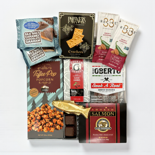 snack box filled with snacks made in WA.  The gift box includes: smoked salmon, pepperoni sticks, raosted nuts, crackers chocolate cherries and a solid chocolate salmon