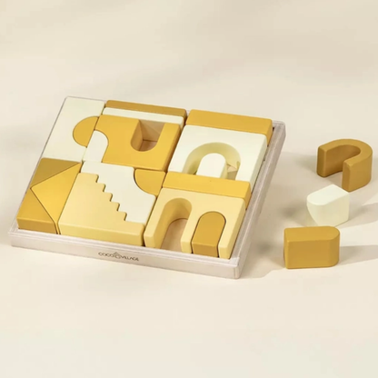 baby blocks gift Set of yellow geometric wooden blocks with a clear plastic tray on a beige background
