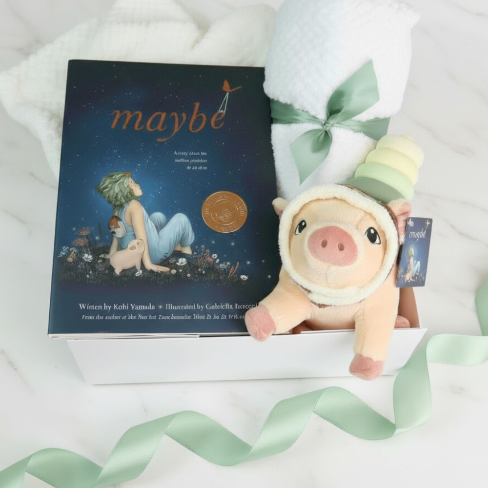 unisex baby gift set with Plush pig toy with a book titled 'maybe' on a white background