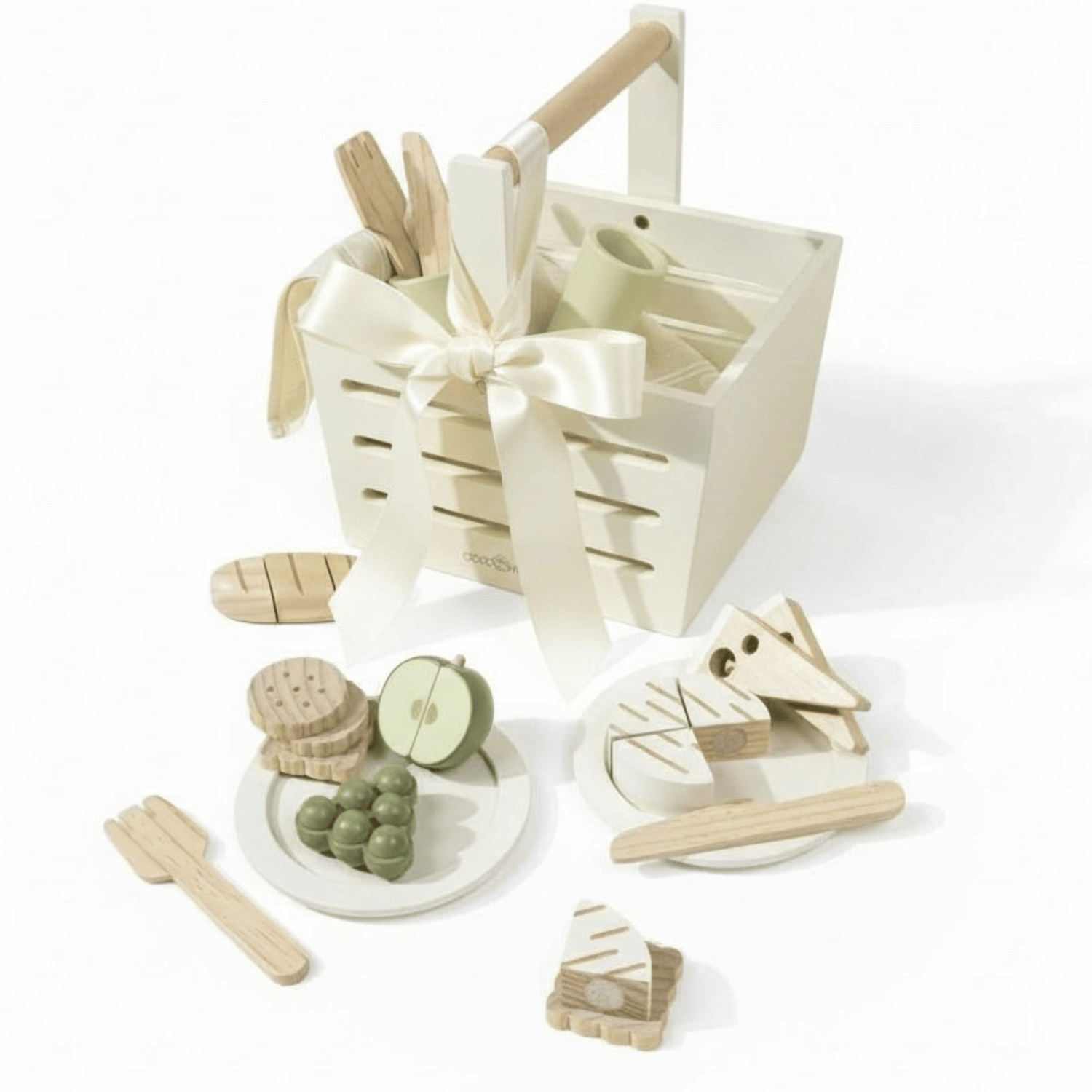 Wooden picnic basket with pretend fruit, crackers, bread, and utensils arranged in neutral tones.