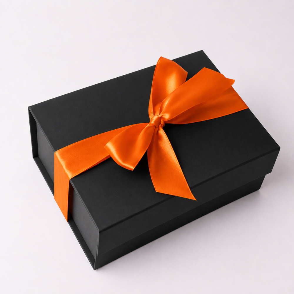Black Halloween gift box finished with a bright orange satin ribbon and bow.