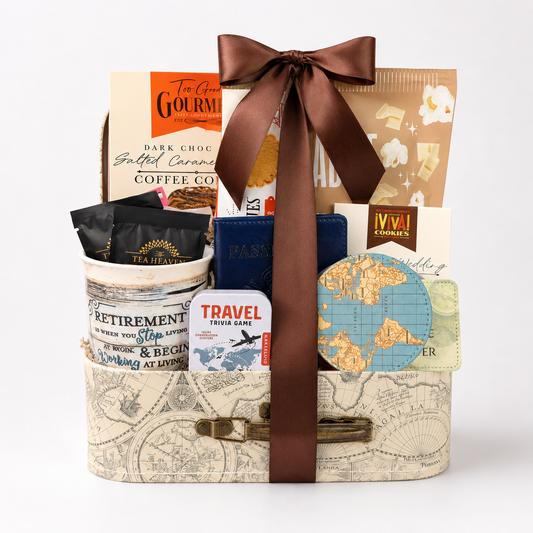 Retirement gift basket with travel themed goodies.  Basket includes travel snacks, retirement mug, stone coasters, and notebook all assembled in a decorative mini suitcase.