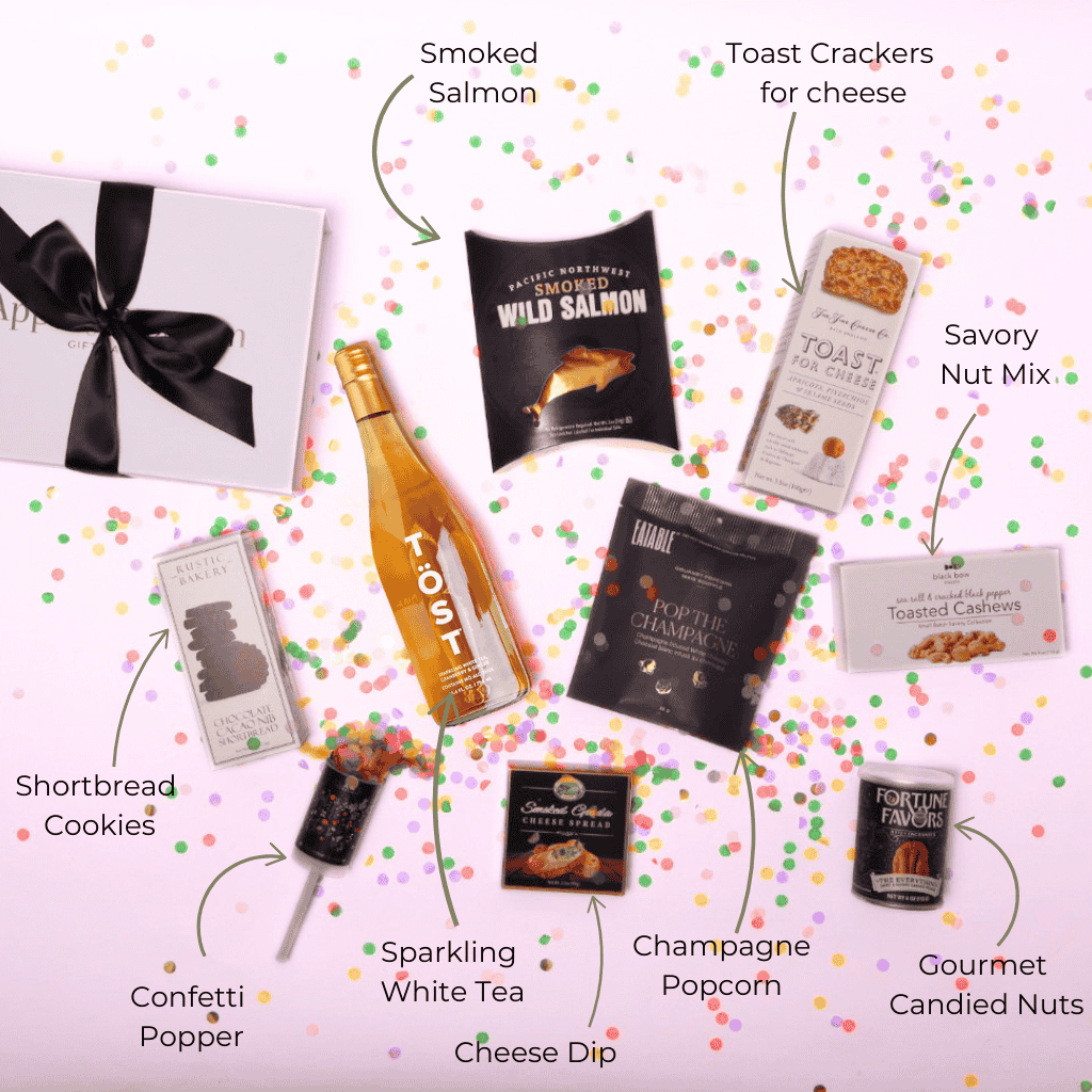 A beautifully arranged flat lay of our premium sparkling white tea and gourmet gift set, including cheese, pacific northwest smoked salmon, and chocolates—an elegant gift for birthdays, anniversaries, and celebrations.