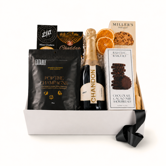 champagne gift basket with pop the champagne popcorn and celebration themed snacks made in WA