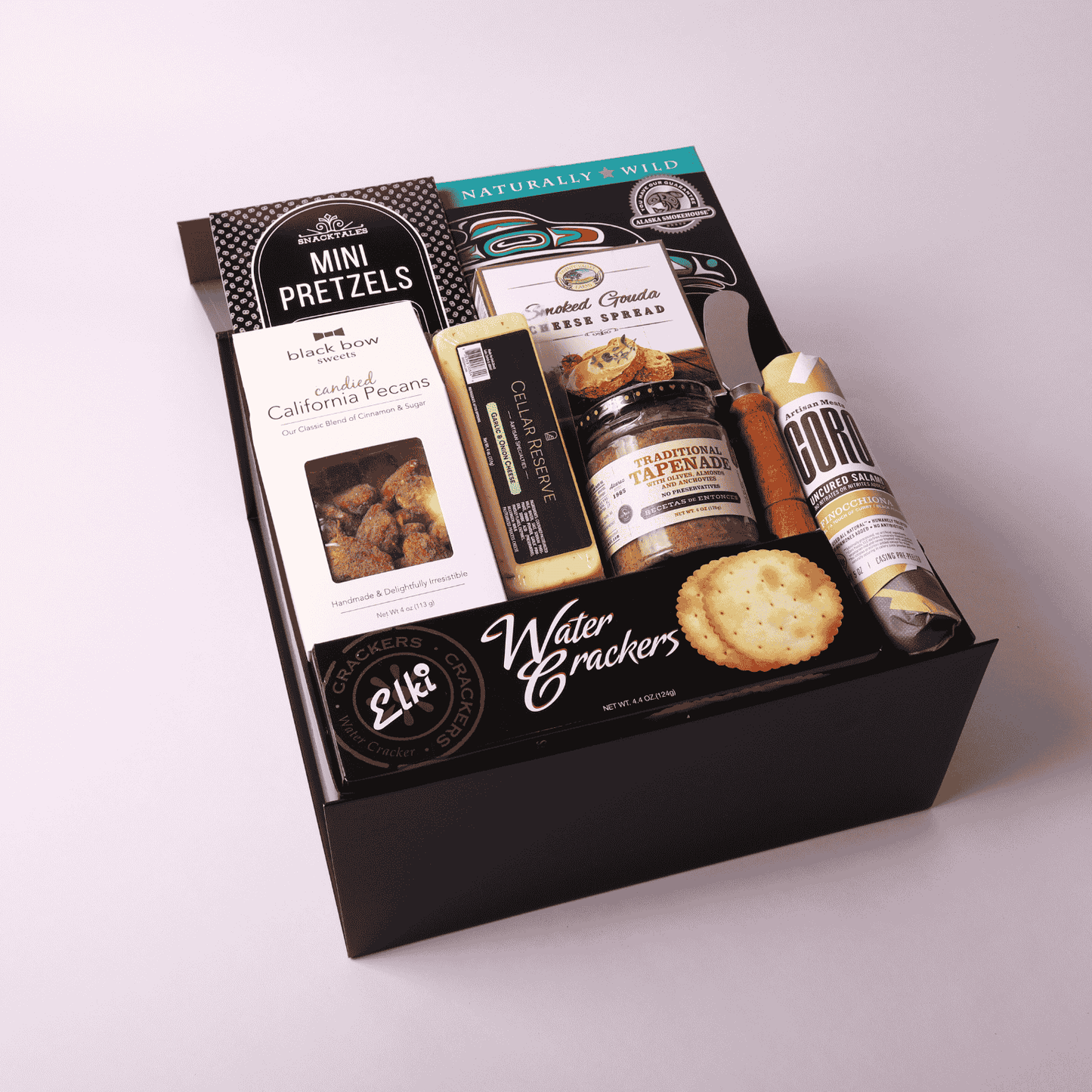 Charcuterie gift box made in WA, featuring gourmet meats, cheeses, nuts, and tapenade. Perfect for corporate gifting, holiday events, or client appreciation. A delicious taste of Seattle in a beautifully assembled box.