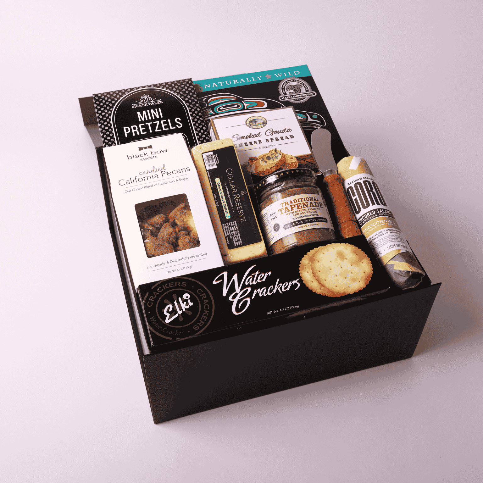 Charcuterie gift box made in WA, featuring gourmet meats, cheeses, nuts, and tapenade. Perfect for corporate gifting, holiday events, or client appreciation. A delicious taste of Seattle in a beautifully assembled box.