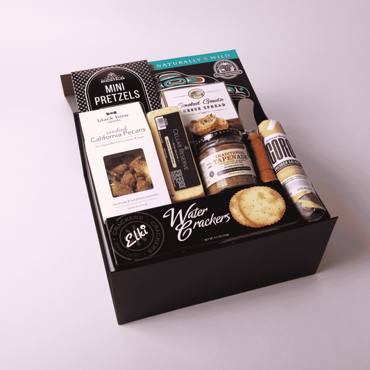 Charcuterie gift box made in WA, featuring gourmet meats, cheeses, nuts, and tapenade. Perfect for corporate gifting, holiday events, or client appreciation. A delicious taste of Seattle in a beautifully assembled box.