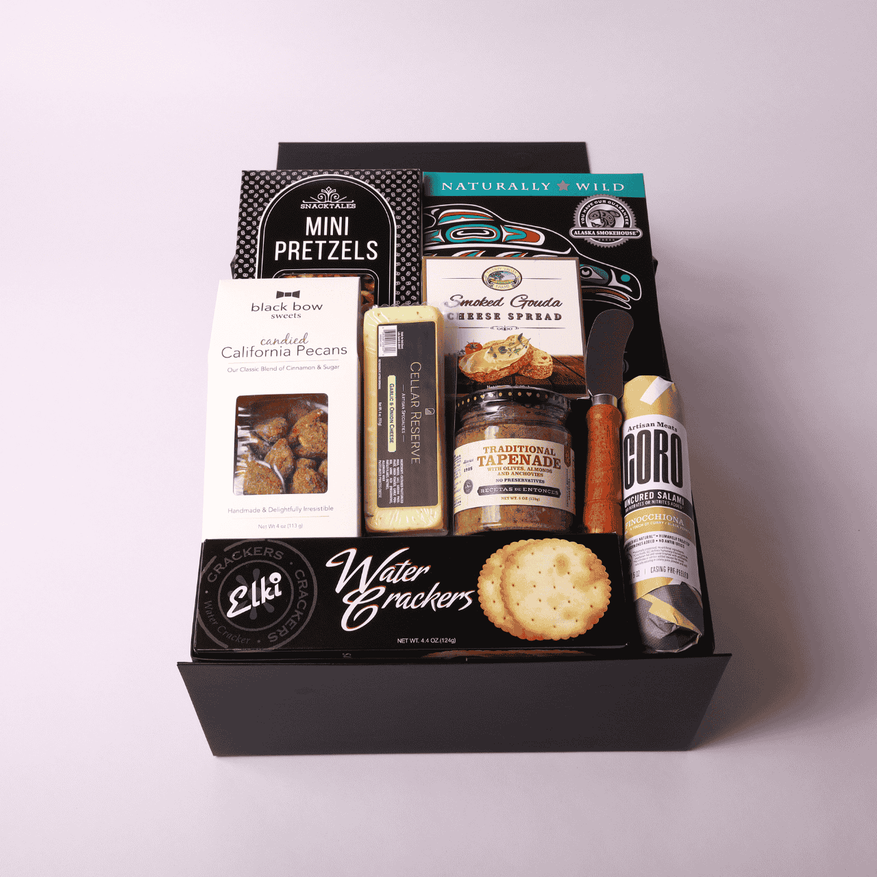 Seattle-made charcuterie gift box with uncured salami, smoked salmon, and savory treats. An ideal corporate gift, holiday gift, or snack basket for client appreciation, family gatherings, or special occasions.