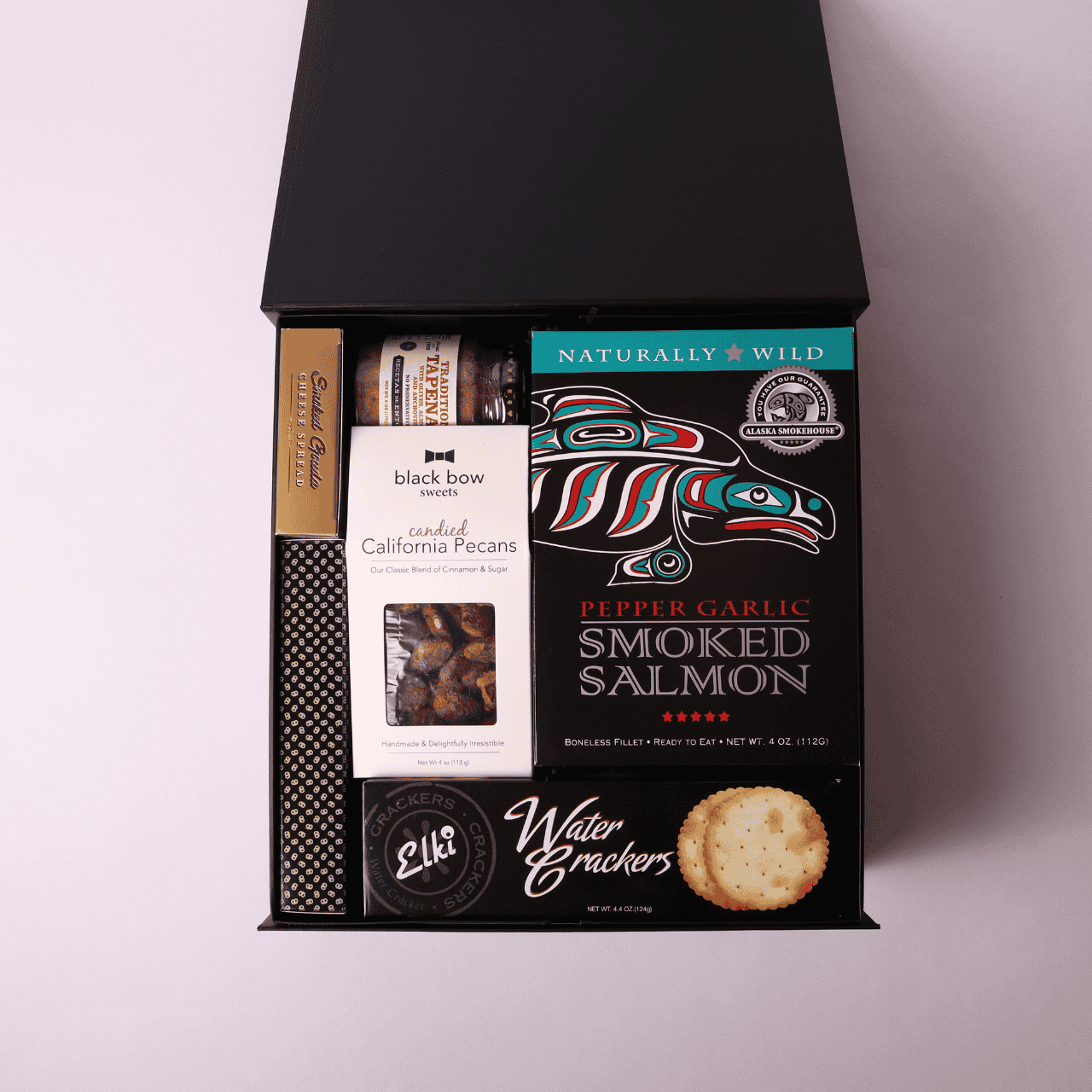 Charcuterie gift box made in WA, showcasing local Seattle flavors. Packed with meats, cheeses, and spreads, this is a perfect corporate gift or holiday gift basket for sharing and celebrating.