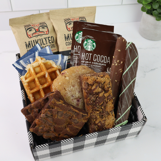 A beautifully curated coffee gift box featuring made in Washington artisan coffee, gourmet cookies, biscotti, brownies, and a freshly baked cinnamon roll—perfect for a thinking of you gift, birthday gift, or coffee drinker gift.
