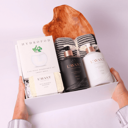 Premium housewarming gift box with Seattle based L'AVANT Collective's luxurious home essentials, a hydroponic herb-growing kit, eco-friendly kitchen accessories, and a handcrafted acacia board—thoughtfully curated for new homeowners.