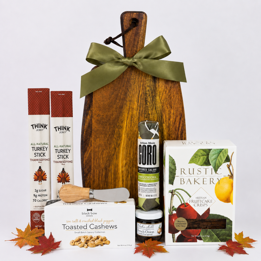 Fall Gather Board gift with acacia serving board, artisan salami, fruitcake crisps, turkey sticks, cashews, French onion spread and cheese spreader.