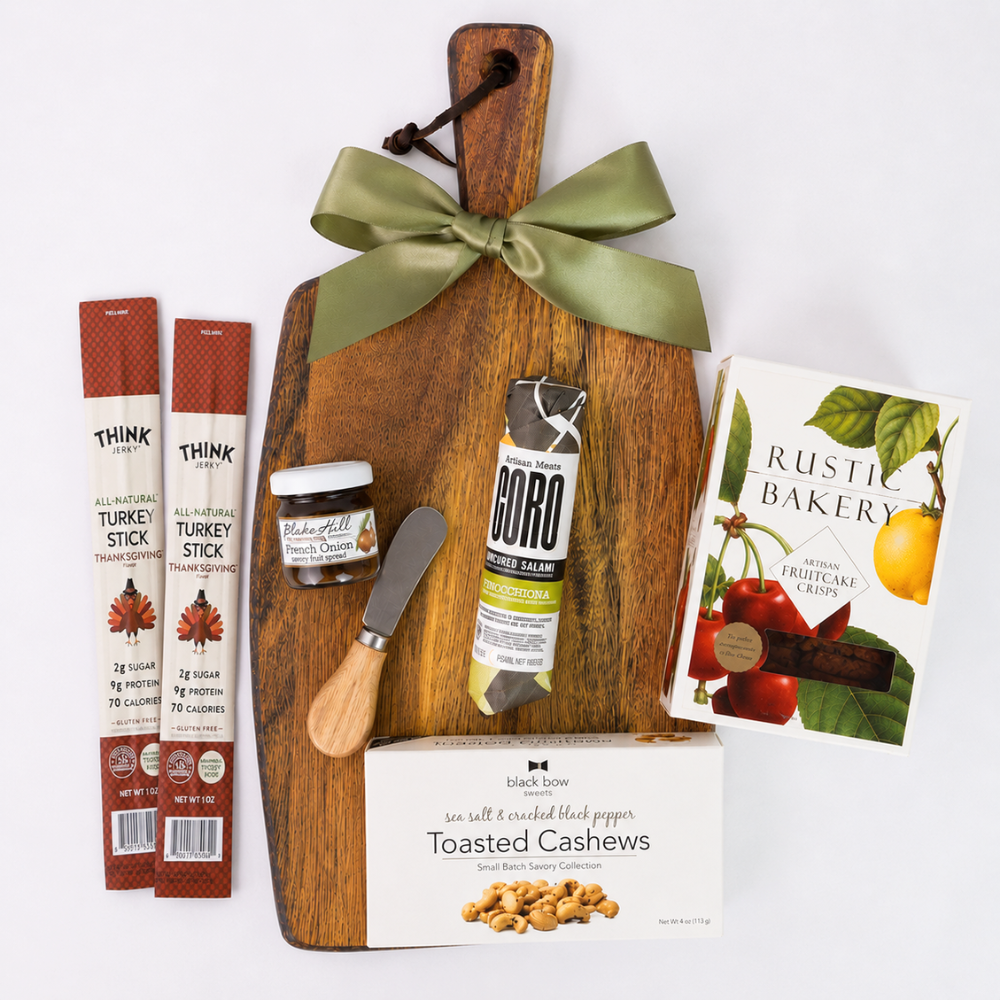 Fall Gather Board gift with acacia serving board, artisan salami, fruitcake crisps, turkey sticks, cashews, French onion spread and cheese spreader.