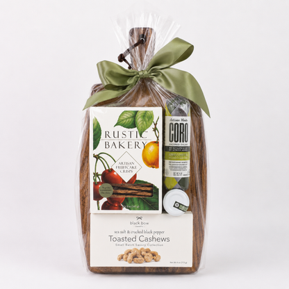 Fall Gather Board gift with acacia serving board, artisan salami, fruitcake crisps, turkey sticks, cashews, French onion spread and cheese spreader.