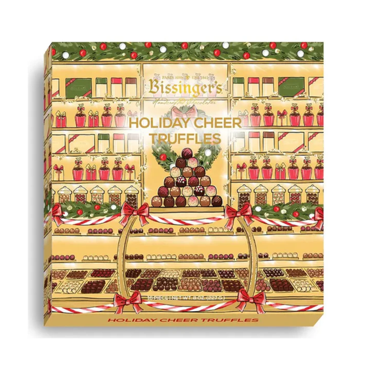 Holiday Cheer Truffles 16-piece gift box with festive holiday packaging featuring gold, red bows, and shelves of chocolates.