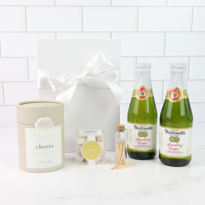 Seattle celebration gift basket with Martinelli’s sparkling cider, candles, and glassware
