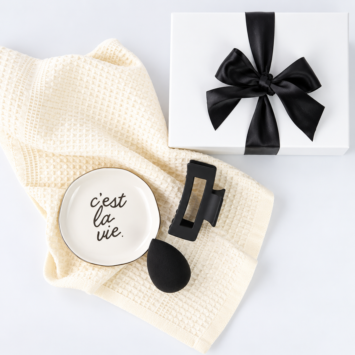 mini for her gift box with towel, trinket tray, hair clip and makeup sponge.