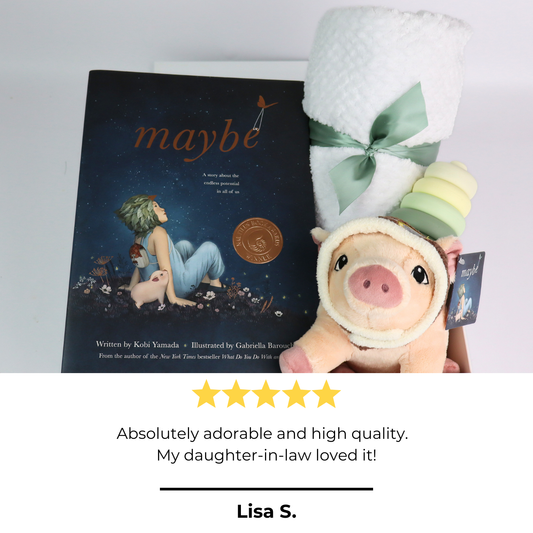 baby gift box with Book titled 'maybe' with a plush toy and baby blanket on a light gray background