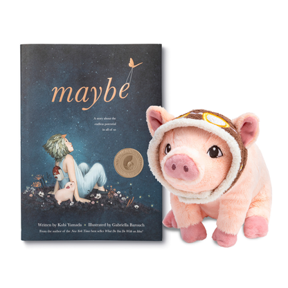 Book titled 'maybe' with a plush pig toy wearing a helmet on a white background