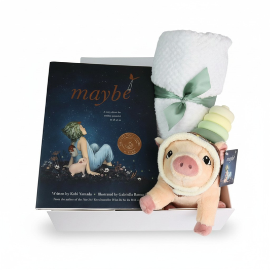 baby gift box with Plush toy pig with a book titled 'maybe' on a white background