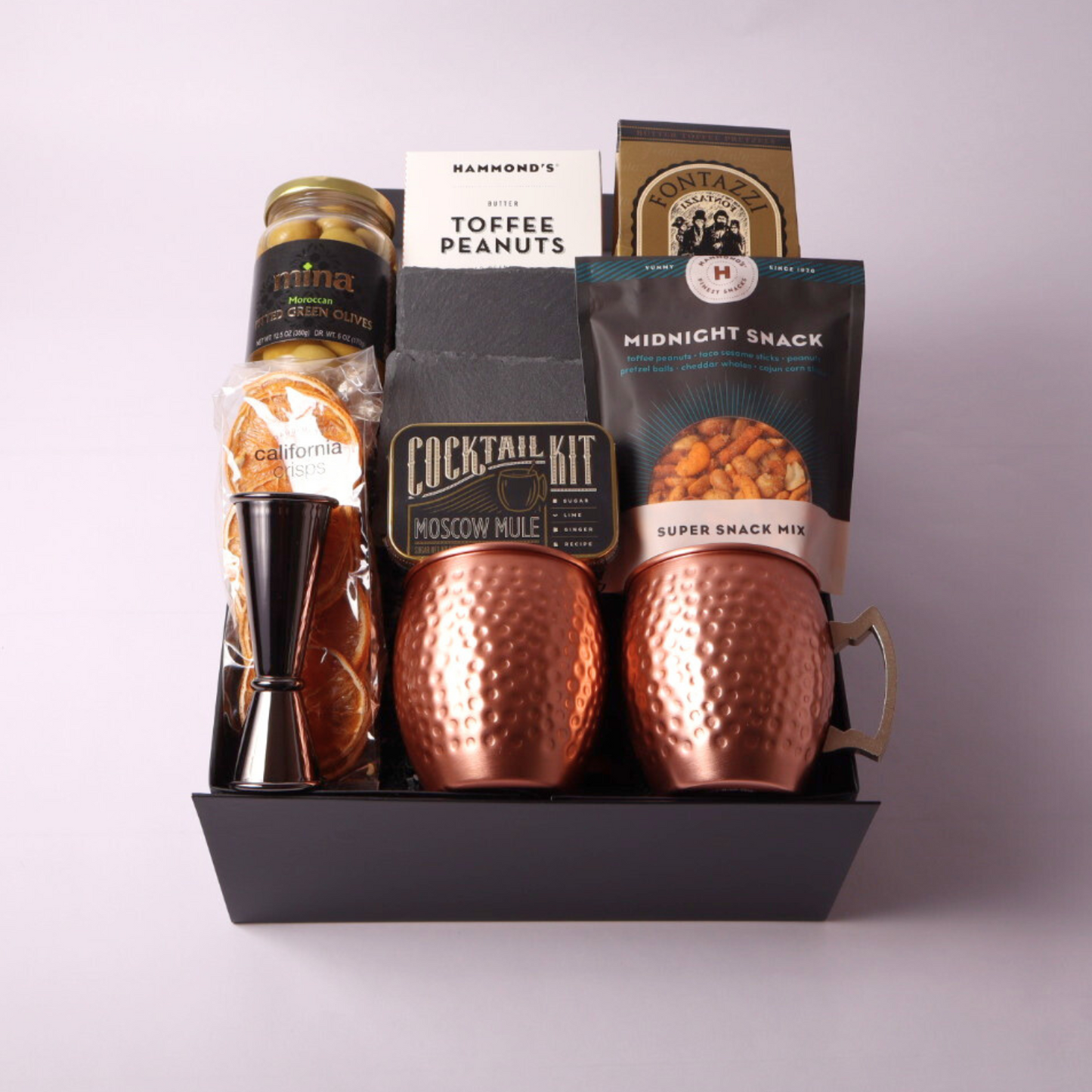 Elevate your gifting with our Moscow Mule Gift Box, complete with copper mugs, premium mixer kit, and Washington-made snacks. A unique and luxurious choice for client gifts or birthdays.