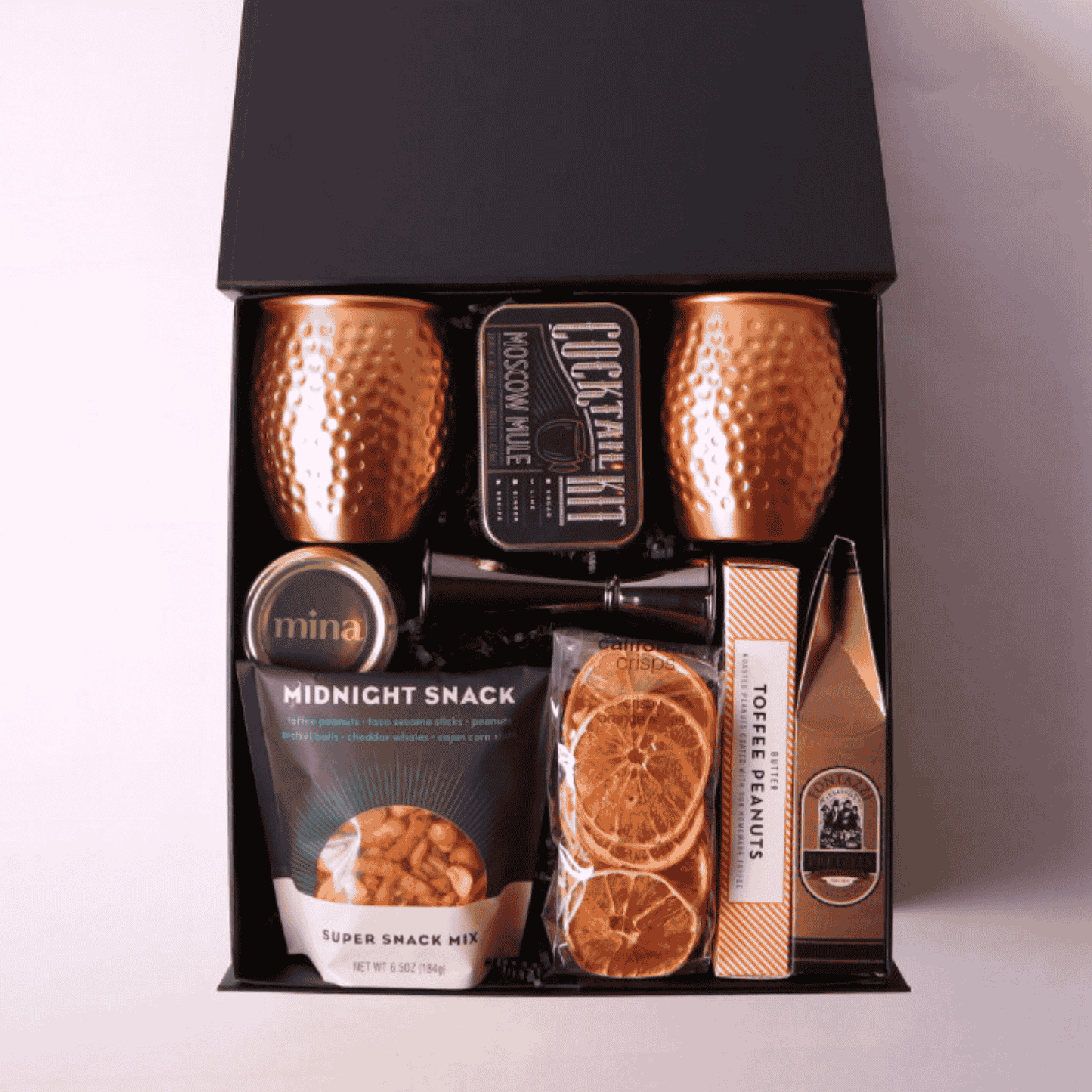 Moscow Mule Gift Box with copper mugs, slate coasters, and gourmet treats, including products made in WA. Ideal for client appreciation, birthdays, or a luxury gift for him.