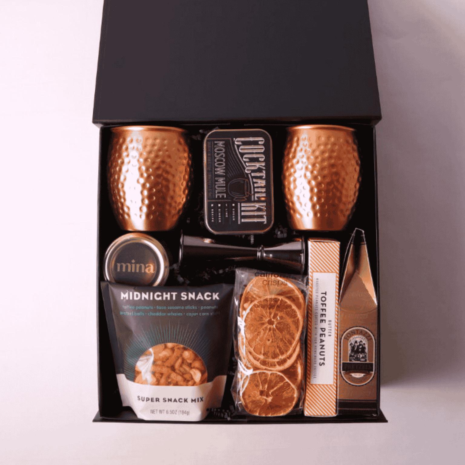 Moscow Mule Gift Box with copper mugs, slate coasters, and gourmet treats, including products made in WA. Ideal for client appreciation, birthdays, or a luxury gift for him.