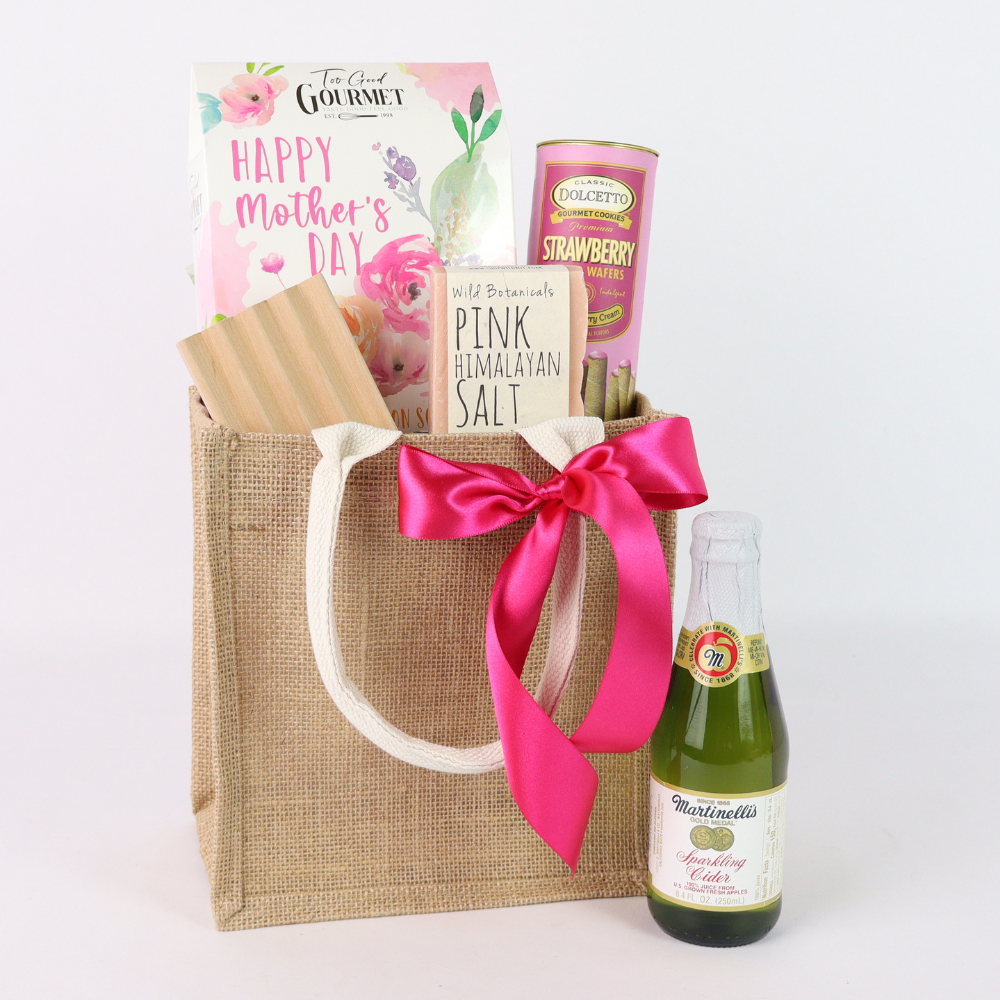 Mother’s Day spa and sweets gift tote with sparkling cider, strawberry wafers, Himalayan salt soap, and pink ribbon