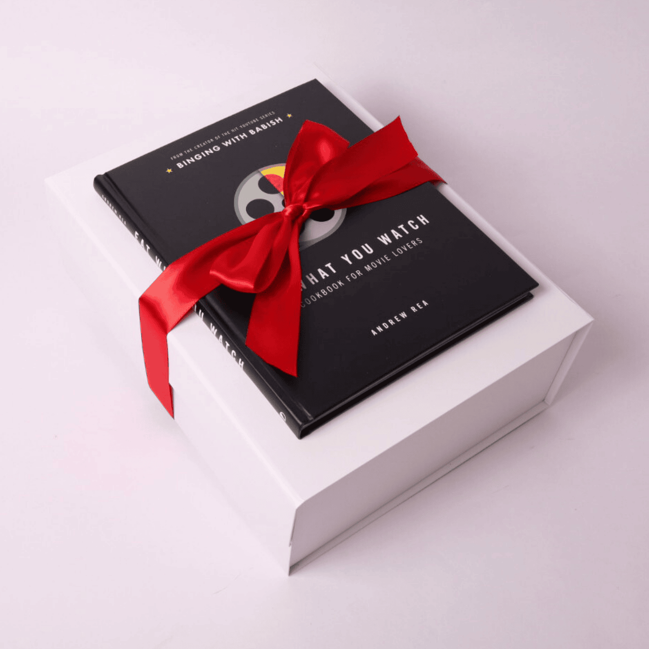 Movie night gift box elegantly wrapped in our signature box with a vibrant red satin bow, perfect for family nights or a couple’s cozy evening.